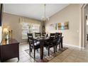 Lovely dining room with neutral walls, stylish lighting, and a beautiful dining set at 151 Hideaway Beach Ln, Kissimmee, FL 34746