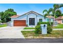 Beautiful single-story home with a well-maintained lawn and mature landscaping at 1553 Wright Dr, Lakeland, FL 33805