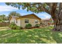The house features a large backyard with lush landscaping, providing privacy and a serene outdoor space at 320 Boger S Blvd, Lakeland, FL 33803