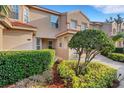 Charming home featuring well-maintained landscaping with shrubs and mulch and a two-car garage at 351 Enclave Dr # 94, Lakeland, FL 33803