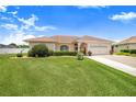 Charming single-story home with well-manicured lawn and landscaping, offering great curb appeal and a welcoming atmosphere at 413 Ruby Lake Pl, Winter Haven, FL 33884