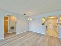 Dining area with hardwood floors, open to the kitchen and bathroom at 615 Ridge Ter # 615, Winter Haven, FL 33881