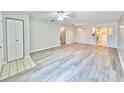 Spacious living room features hardwood floors, open floor plan, and abundant natural light at 615 Ridge Ter # 615, Winter Haven, FL 33881
