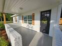 Inviting front porch with freshly painted brick, updated lighting, and an elegant wreath on the front door at 631 Julia Se St, Winter Haven, FL 33880
