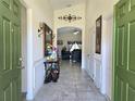Warm entryway with ceramic tile and decorative accents that leads to the living area at 830 Cabaret Ct, Kissimmee, FL 34759