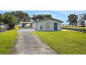 Attractive single story home featuring a spacious driveway, and waterfront access at 8314 W Lake Marion Rd, Haines City, FL 33844