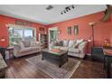 Inviting living room featuring cozy seating, hardwood floors, and natural light creating a welcoming atmosphere at 1256 Center St, Lake Wales, FL 33859