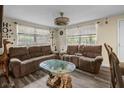 Cozy living room with comfortable seating, unique table, and lots of natural light at 2480 Avenue E Sw, Winter Haven, FL 33880