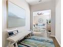 Inviting entryway featuring stylish decor, accent bench, and a glimpse into the bright and open living space at 481 Kensington View Dr, Winter Haven, FL 33880