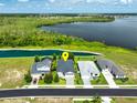 An aerial shot of a beautiful single-story home in a neighborhood with lake views, showcasing its location at 505 Adams View Ln, Auburndale, FL 33823