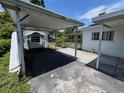 View of the carport and side of home showing ample space for parking at 507 Avenue H Se, Winter Haven, FL 33880