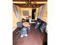Sunroom with hardwood floors and ceiling fan in need of cleaning at 803 26Th Nw St, Winter Haven, FL 33881