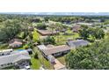 Aerial view of the home's location and surroundings with mature trees, nearby school, and convenient access at 1019 Milner E Dr, Lakeland, FL 33810