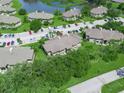 Aerial view of real estate showcasing community and landscaping at 1102 Eagle Pond Dr # 1102, Winter Haven, FL 33884