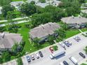 Aerial shot of property featuring manicured lawns and tropical landscaping at 1102 Eagle Pond Dr # 1102, Winter Haven, FL 33884