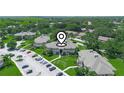 Aerial view of community including complex, landscaping, and parking at 1507 Eagle Pond Dr # 1507, Winter Haven, FL 33884