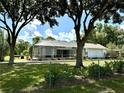Enclosed pool area featuring a screened-in pool with an attached spa at 1976 Holy Cow Rd, Polk City, FL 33868