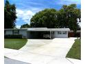 Charming single story home with a well-maintained lawn and covered parking at 2021 Oliver Pl, Winter Haven, FL 33881