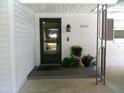 Close up of front door entry with address plaque, decorations, and door bell at 2021 Oliver Pl, Winter Haven, FL 33881