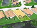 Aerial view of the property showcases its prime location, manicured landscaping, and stunning waterfront views at 3802 Litchfield Loop, Lake Wales, FL 33859