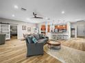 Comfortable living space open to kitchen and dining areas, featuring modern furnishings and abundant natural light at 3802 Litchfield Loop, Lake Wales, FL 33859