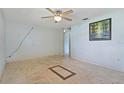 Light-filled living room features elegant tile floors, creating a welcoming and stylish atmosphere at 407 Snively Ave, Winter Haven, FL 33880