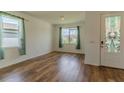 Bright living room featuring wood floors and natural light at 6300 Dolostone Dr, Lakeland, FL 33811