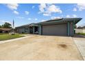 Well-maintained home with a spacious driveway and attached two-car garage at 704 Butternut Pl, Lakeland, FL 33813