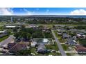 An aerial view of the property highlighting its location within a residential neighborhood near shopping and amenities at 124 Tyler St, Lake Wales, FL 33859