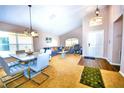 Open-concept living area with dining space, comfortable seating, and large windows at 2169 Rose Blvd, Winter Haven, FL 33881