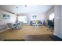 Spacious living room featuring comfortable seating, large windows, and a separate dining area, a welcoming space at 2169 Rose Blvd, Winter Haven, FL 33881