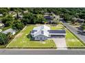 An aerial view showcases this quaint home's perimeter and its placement within the community at 2218 Melbourne Ave, Haines City, FL 33844