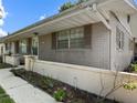 Charming brick home with well-maintained landscaping and neutral shutters at 2800 Sunset Nw Dr, Winter Haven, FL 33881