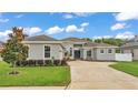 Charming single-story home features a well-manicured lawn, fresh landscaping, and neutral stucco exterior at 308 Kissengen Park Dr, Bartow, FL 33830