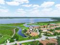 Breathtaking aerial view of the community, showcasing the lake, golf course, and beautiful homes at 4105 Limerick Dr, Lake Wales, FL 33859