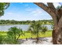 Scenic view of the serene lake showcasing the natural beauty of the waterfront property at 452 Lake Suzanne Dr, Lake Wales, FL 33859