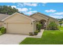 A well-manicured lawn and tasteful landscaping highlight the exterior of this charming single-Gathering home at 464 Lake Suzanne Dr, Lake Wales, FL 33859