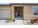 Close-up of a welcoming front entrance with a simple black front door at 4662 Osprey Way, Winter Haven, FL 33881