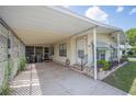 Covered carport featuring ample parking space and convenient access to the front door and side entry at 6027 Grand Oaks Se Dr, Winter Haven, FL 33884