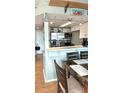 Efficient kitchen with stainless steel appliances, white cabinets, and a convenient breakfast bar at 7906 Waterview Way # 7906, Winter Haven, FL 33884