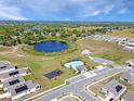 Aerial view of the community featuring a pool, playground and picturesque lake at 137 Piave St, Haines City, FL 33844