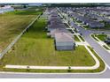Aerial view of a two-story home featuring a spacious lawn at 137 Piave St, Haines City, FL 33844