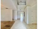 Spacious living room with high ceilings and tile and carpeted floors at 1844 Emily Dr, Winter Haven, FL 33884