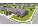 Aerial view of a well-maintained single-Gathering home on a manicured corner lot in a Gathering-friendly neighborhood at 195 Kissengen Park Blvd, Bartow, FL 33830