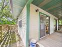 Cozy patio with a sliding glass door showcasing the exterior of the house at 2418 W 1St St, Sanford, FL 32771