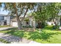 Charming single-story home with well-maintained lawn and mature trees at 2505 Brownwood Dr, Mulberry, FL 33860