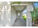 Covered front porch with a decorative glass front door at 2505 Brownwood Dr, Mulberry, FL 33860