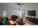 Cozy living room with comfortable seating, modern TV, and stylish decor at 919 Timor Ave, Orlando, FL 32804