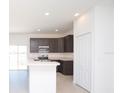 Modern kitchen with stainless steel appliances and an island at 322 Brennan Ave, Frostproof, FL 33843