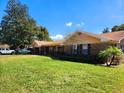 Beautiful home featuring a lush green lawn and a well-maintained exterior at 413 Sandy Hill Dr, Longwood, FL 32779